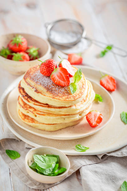 istock Tasty american pancakes for breakfast on white table 1046539090