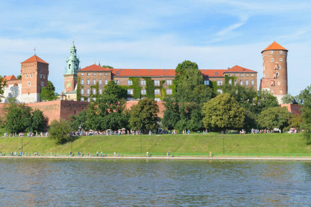 Wawel Royal Castle Krakow, Poland - August 12 2018:Wawel royal castle view from across the river Vistula (Wisla) at sunset wawel cathedral stock pictures, royalty-free photos & images