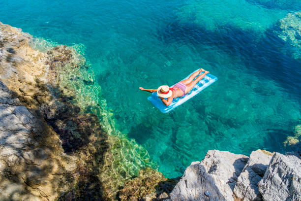 istock Women is sunbathing on the seabed. 1046539666