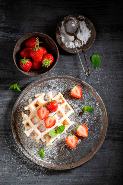 istock Fresh wafers with fresh strawberries and sugar 1046543734
