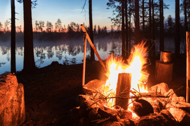 istock Fireplace in camping near lake at dark night 1046543784