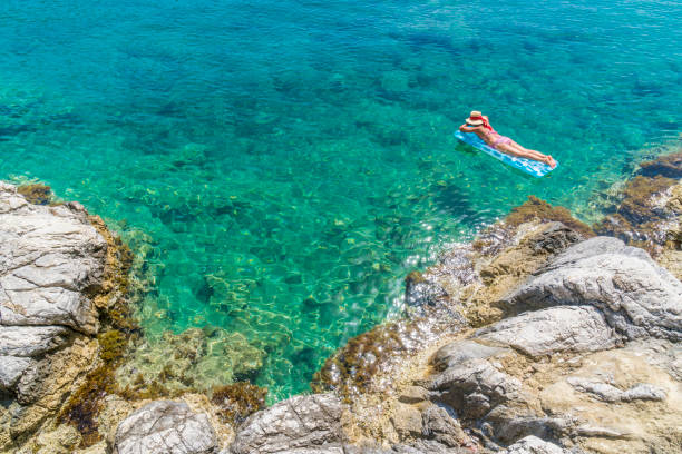 istock Women is sunbathing on the seabed. 1046546568