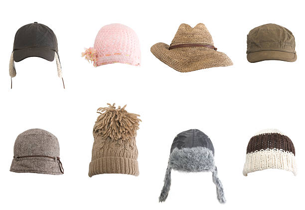Rows of different kinds of hats against white background A collection of various hats isolated on white. cap hat stock pictures, royalty-free photos & images