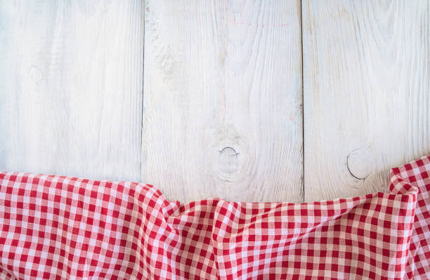 istock White and red checkered tableclothe on white paint wooden background with copy space 1046554336