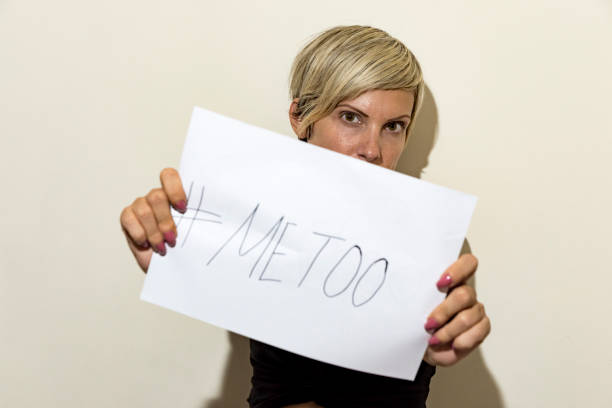 istock woman holding sign 1046555932