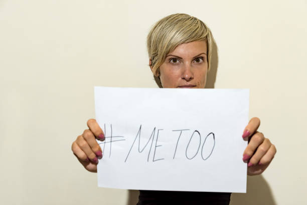istock woman holding sign 1046559038
