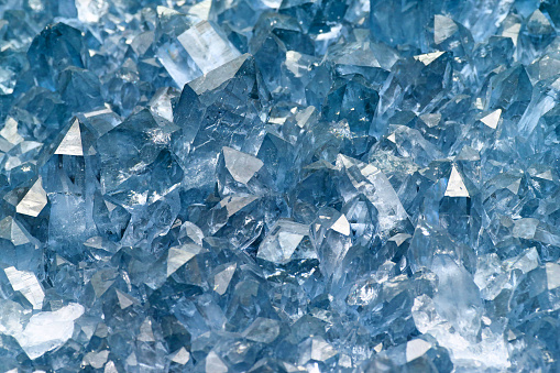 Quartz crystal cluster high size on black background, mineral also used as semi-precious gemstones. Silica, silicon dioxide, SiO2.