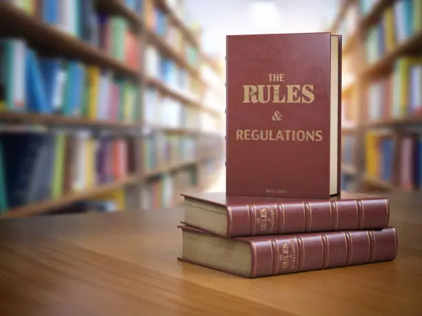 Photo of Rules and regulations books with official instructions and directions of organization or team.