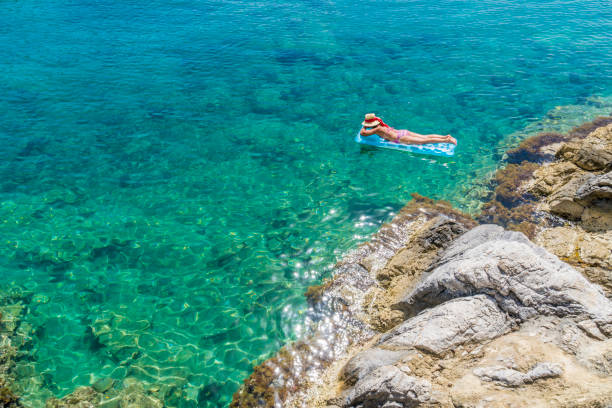 istock Women is sunbathing on the seabed. 1046560482