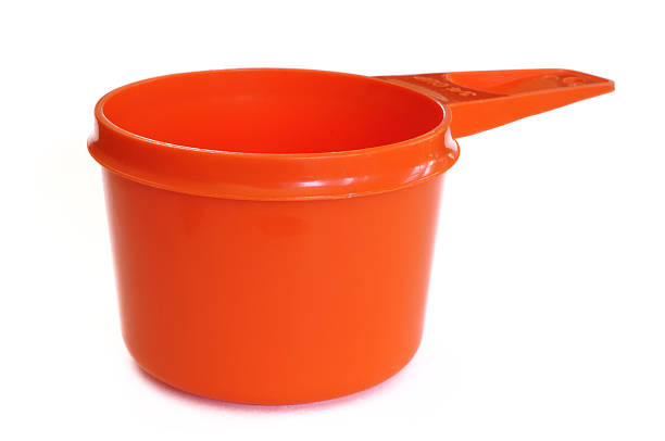 Orange Plastic Measuring Cup stock photo