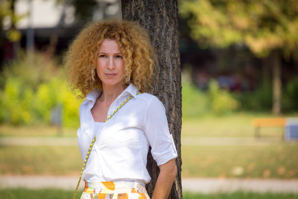 istock Woman with curly hair 1046565670