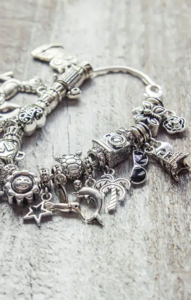 bracelet with charms. selective focus. Beauty and fashion.