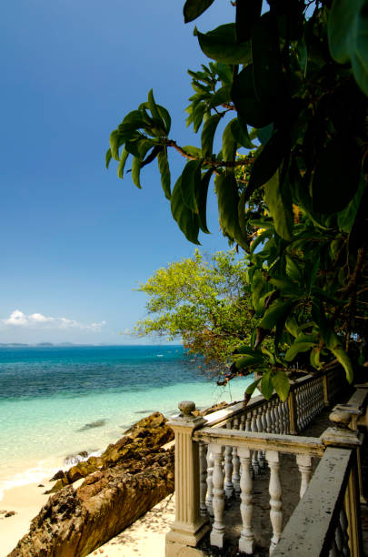 istock walk path along  tropical beach at sunny day. cloudy and blue sky background at sunny day 1046569982