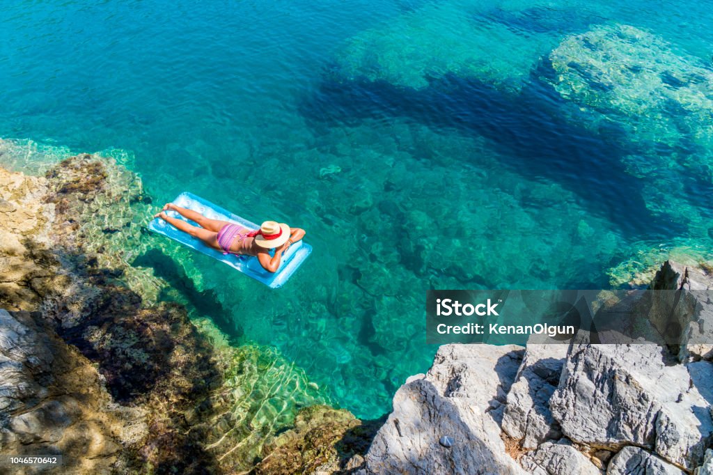 Women is sunbathing on the seabed. Türkiye - Country Stock Photo