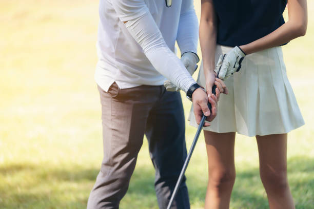 istock Midsection Of People Playing Golf On Field 1046570844