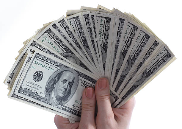 istock Dollars are in womanish hands. 104657866