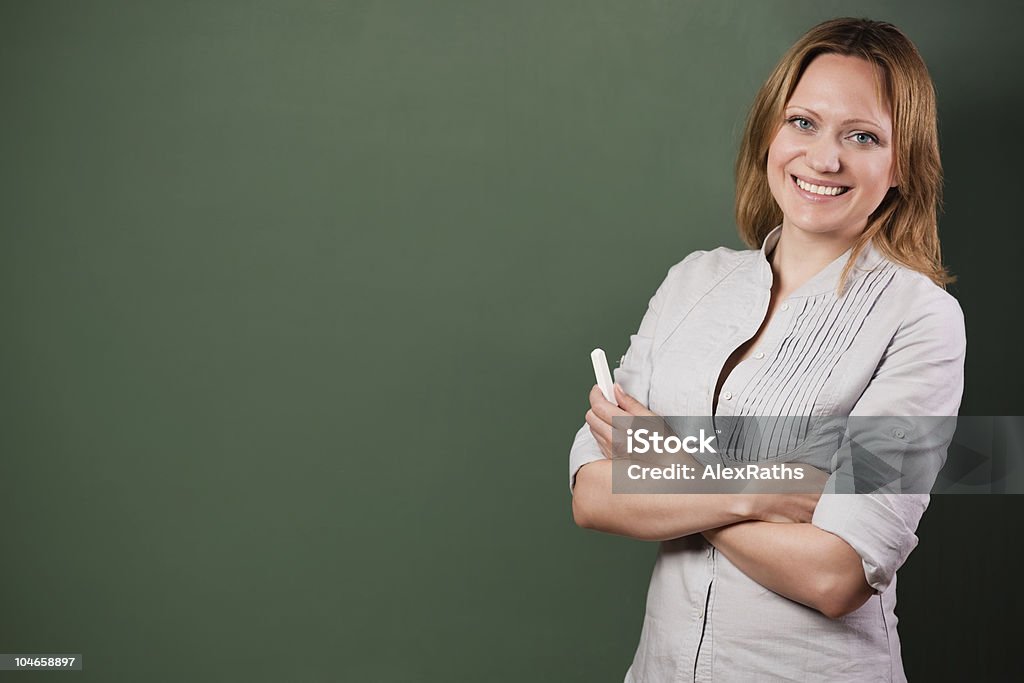 at the blackboard  Teacher Stock Photo