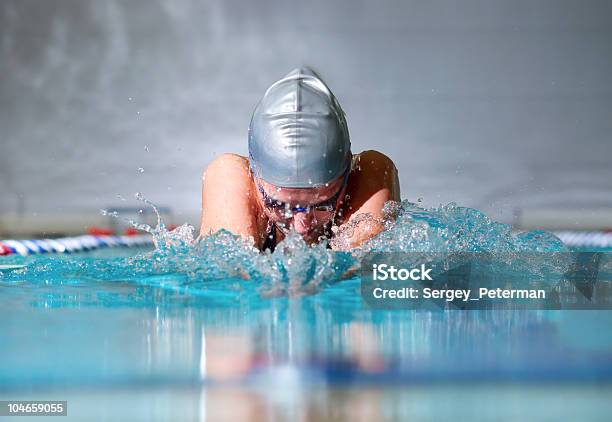 Female Swimmer With Gray Cap Doing Breaststroke Stock Photo - Download Image Now - Swimming, Close-up, Sport