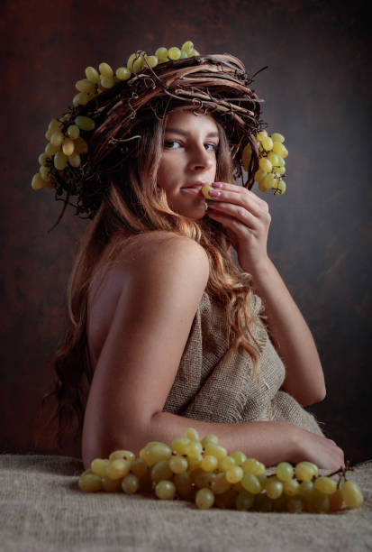 istock Young beautiful woman with grapes. 1046594816