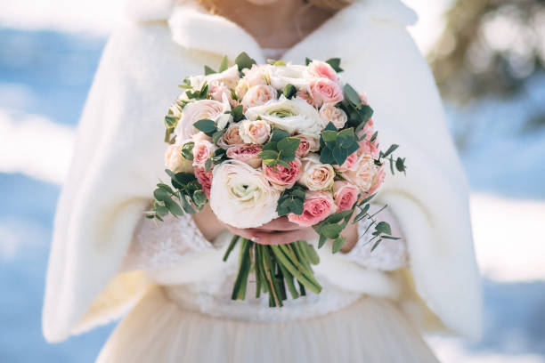 istock Wedding bouquet in hands of the bride 1046595754
