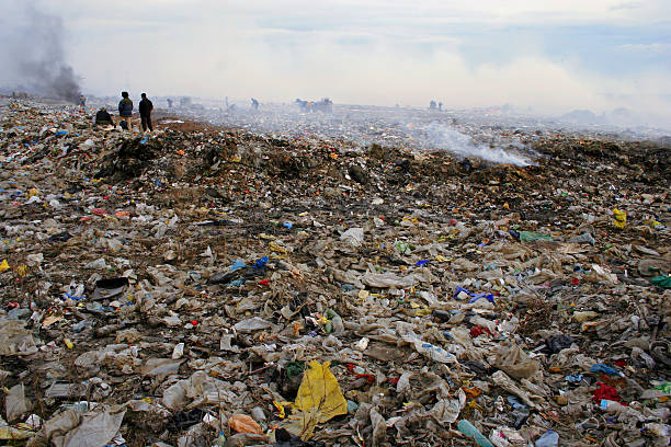 istock People who live in Garbage. Smoke. Pollution. 104660179