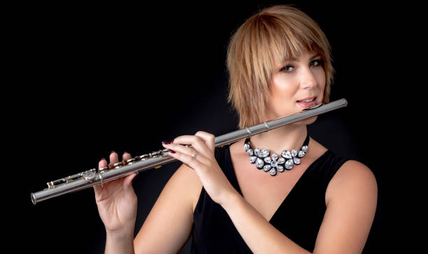 istock Beautiful flute player preparing for the concert 1046602842