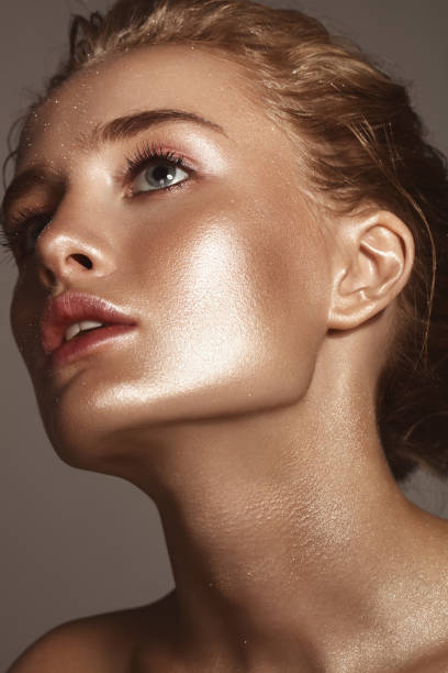 istock Beautiful woman with shiny make-up 1046602866