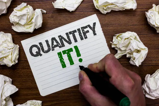 Photo of Conceptual hand writing showing Quantify It. Business photo showcasing Measure the size or amount of something and express in numbers Man holding marker notebook page crumpled papers mistakes.