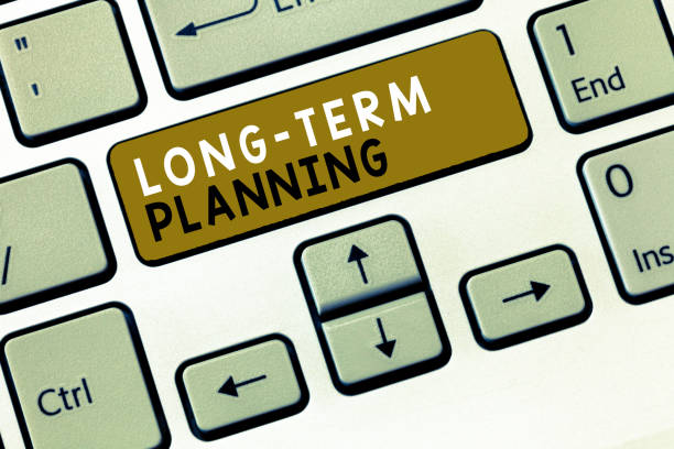 istock Text sign showing Long Term Planning. Conceptual photo Establish Expected Goals five or more years ahead 1046617056