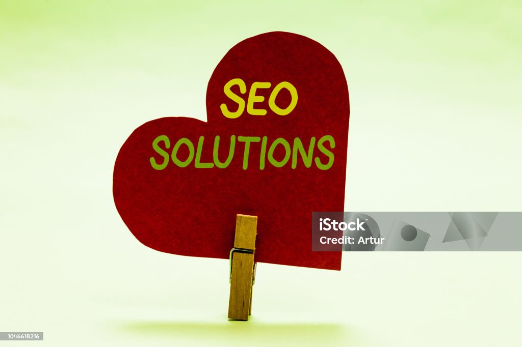 Writing note showing Seo Solutions. Business photo showcasing Search Engine Result Page Increase Visitors by Rankings Clothespin holding red paper heart important romantic message ideas. Writing note showing Seo Solutions. Business photo showcasing Search Engine Result Page Increase Visitors by Rankings Clothespin holding red paper heart important romantic message ideas Efficiency Stock Photo