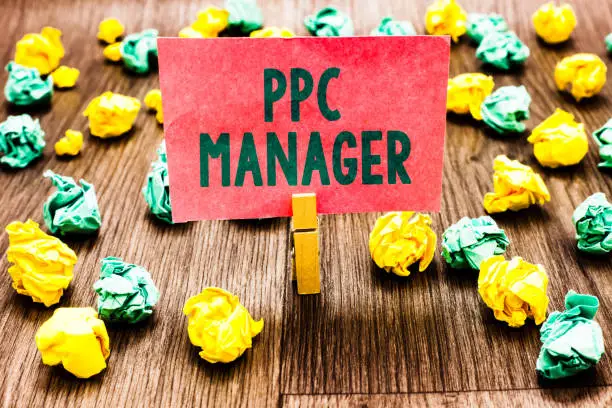 Photo of Word writing text Ppc Manager. Business concept for which advertisers pay fee each time one of their ads is clicked Clothespin holding pink note paper crumpled papers several tries mistakes.