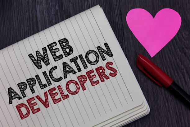 Writing note showing Web Application Developers. Business photo showcasing Internet programming experts Technology software Strikethrough words on notepad love heart pen on blackish woody desk escribir la nota que los desarrolladores de aplicaciones web. foto de negocios mostrando internet programación palabras de tachado de software expertos en tecnología en la pluma de corazón de amor de bloc de notas en el escritorio madera negruzca.