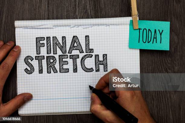 Handwriting Text Writing Final Stretch Concept Meaning Last Leg Concluding Round Ultimate Stage Finale Year Ender Open Notebook Clothespin Holding Reminder Clothespins Clips Wooden Table Stock Photo - Download Image Now
