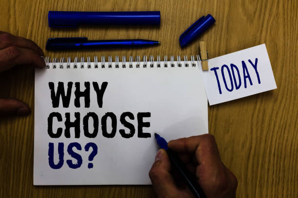 istock Handwriting text Why Choose Us question. Concept meaning Reasons for choosing our brand over others arguments Man holding marker notebook clothespin reminder wooden table cup coffee. 1046619272
