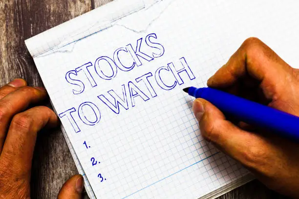Handwriting text writing Stocks To Watch. Concept meaning being heavy broker and watch every increase decrease.