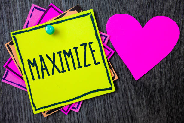 istock Handwriting text writing Maximize. Concept meaning Increase to the greatest possible amount or degree Make larger Border sticky remember cards love heart pinned dark woody background. 1046620226