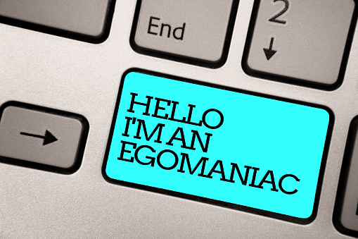 Text sign showing Hello I am An Egomaniac. Conceptual photo Selfish Egocentric Narcissist Self-centered Ego Silver grey computer keyboard with blue button black color written text