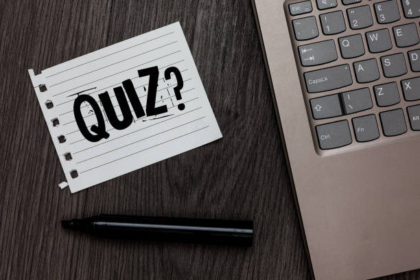 istock Word writing text Quiz Question. Business concept for Short Tests Evaluation Examination to quantify your knowledge Laptop nice computer notebook netbook pen small pitch paper pen wood. 1046620430