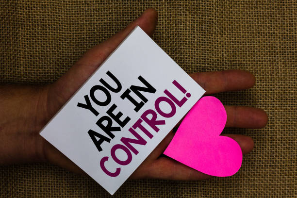 istock Word writing text You Are In Control. Business concept for Responsibility over a situation Management authority Human hand touched white page with letter and love symbol sack base. 1046620450