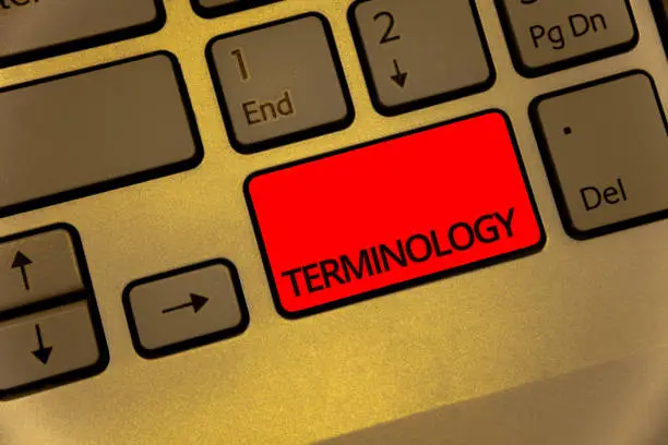 Photo of Text sign showing Terminology. Conceptual photo Collection of terms used by different profession study industry Keyboard brown key yellow laptop creative computer keypad netbook notebook.