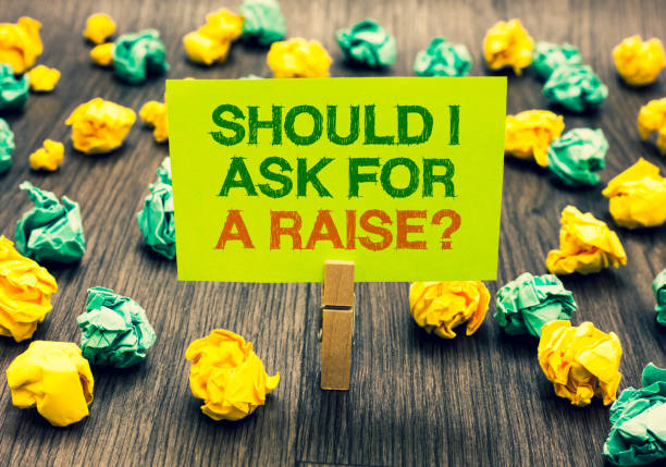 istock Word writing text Should I Ask For A Raise question. Business concept for demanding increase in your month salary Clothespin holding yellow note paper crumpled papers several tries mistakes. 1046623360