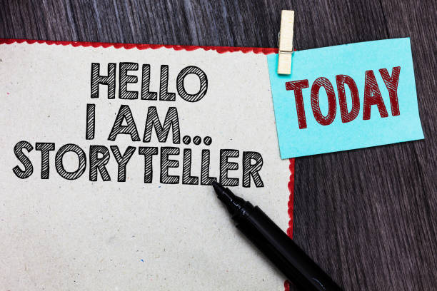 istock Writing note showing Hello I Am... Storyteller. Business photo showcasing introducing yourself as novels article writer White page red borders marker clothespin reminder wooden background. 1046623752