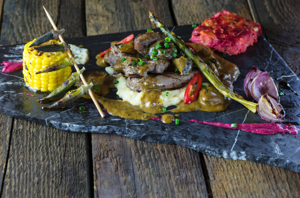 istock grilled meat on wooden back ground 1046623944