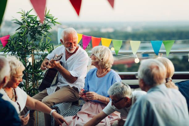 istock Senior Friends Having Fun On Rooftop 1046625338