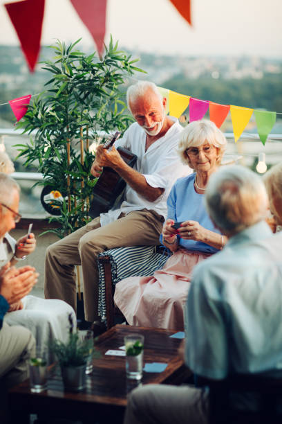 istock Senior Friends Having Fun On Rooftop 1046627078