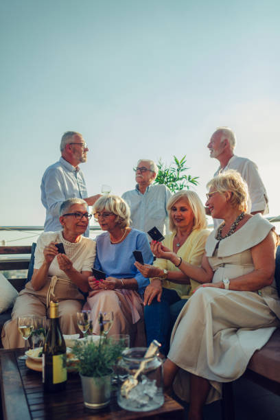 istock Senior Friends Having Fun On Rooftop 1046627674
