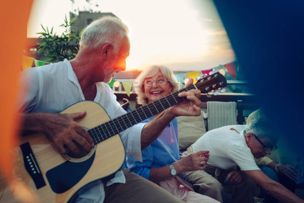 istock Senior Friends Having Fun On Rooftop 1046627706