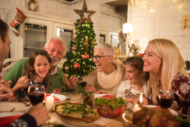 istock Smiling family having a dinner together 1046628330