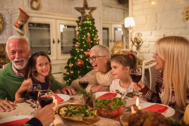 istock Joyful family at dinner party 1046628372