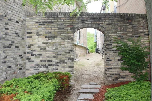 A single archway to the back of the buildings.